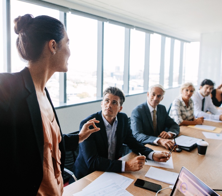 Woman presenting in boardroom